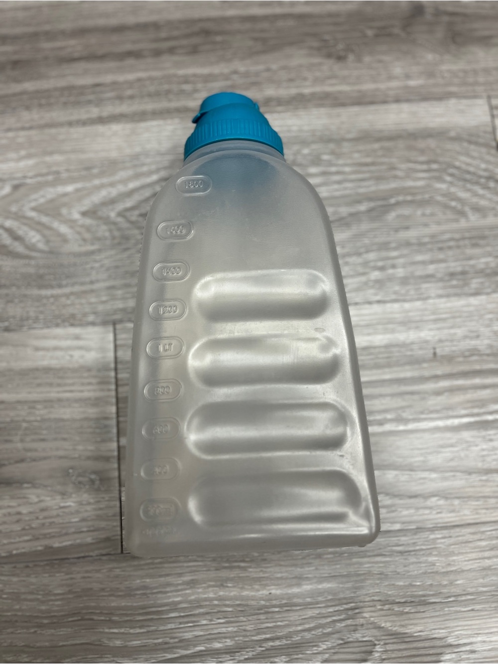 Reusable Frosted Plastic Water Bottle with Blue Cap